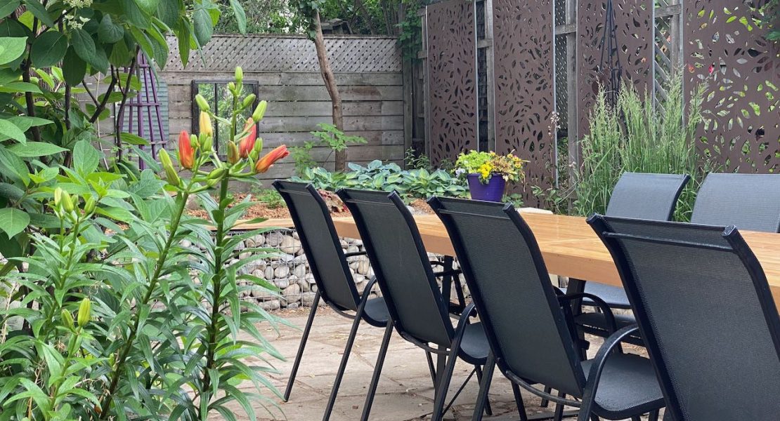 Outdoor dining area in a renovated garden